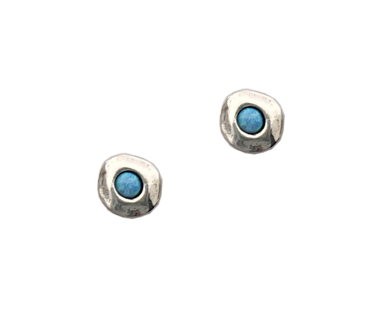 Pair of silver earrings with blue gemstones on a white background