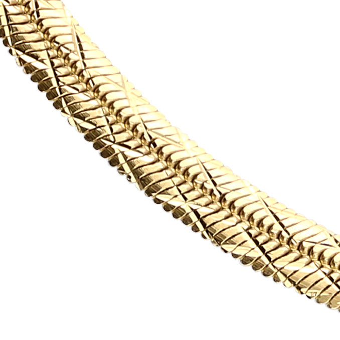 Close-up of a Sterling Silver 18 carat Yellow Gold Vermeil Domed Diamond Cut Herringbone Bracelet