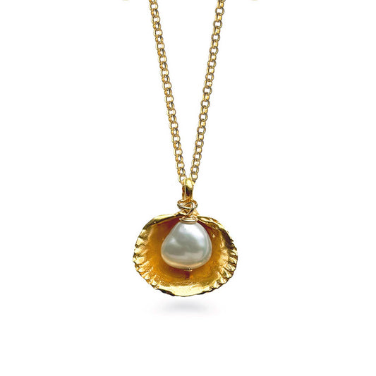 Gold necklace with a shell pendant featuring a pearl on a white background