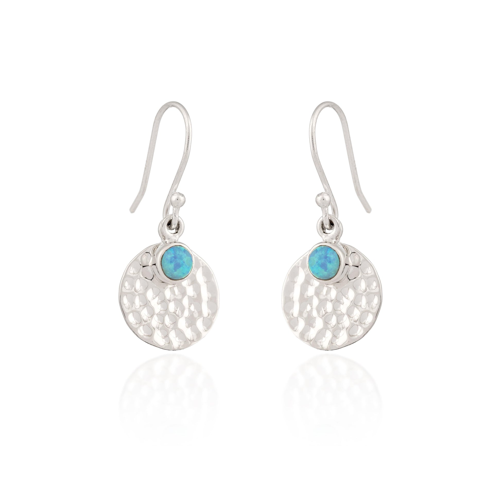 Silver earrings with turquoise stones on a white background