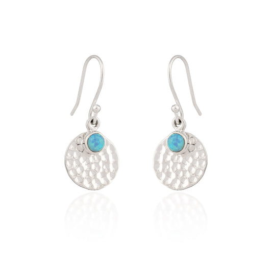 Silver earrings with turquoise stones on a white background