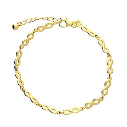 Gold bracelet with intricate links on a white background