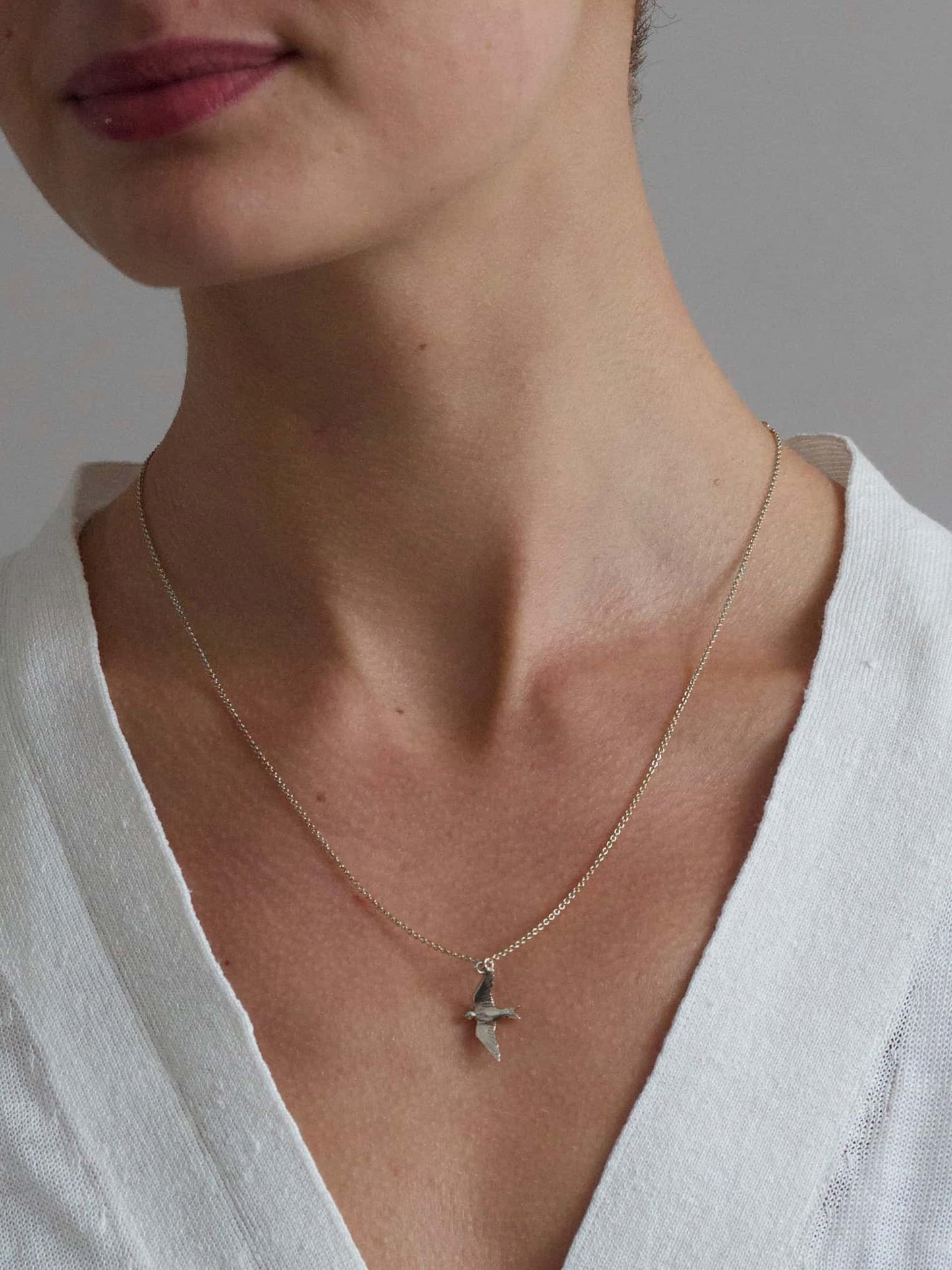 Alex Monroe Sterling Silver Flying Swallow Necklace worn by a model