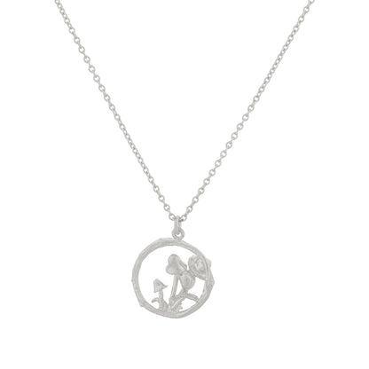Silver necklace with a circular pendant on a white background