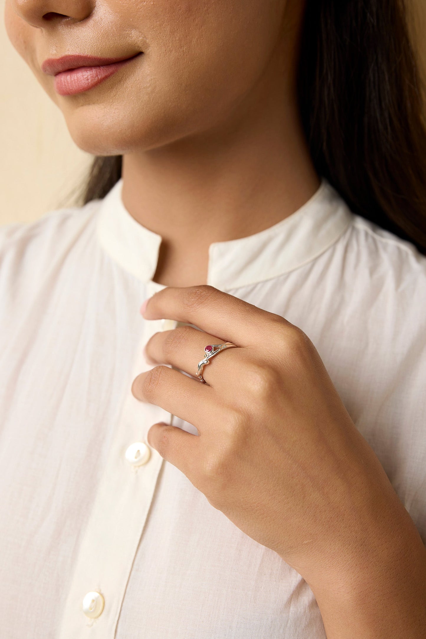 Dainty Ruby Sterling Silver Ring with gold detail modelled on hand