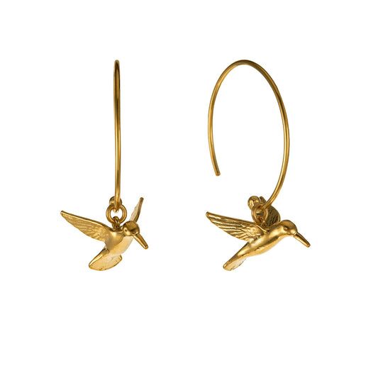 Gold hummingbird earrings on a white background